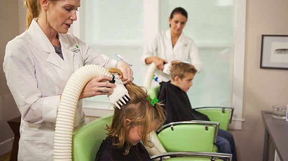 head lice treatment technicians use heated air to remove lice